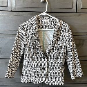Cute blazer in white with black accents. In perfect condition
